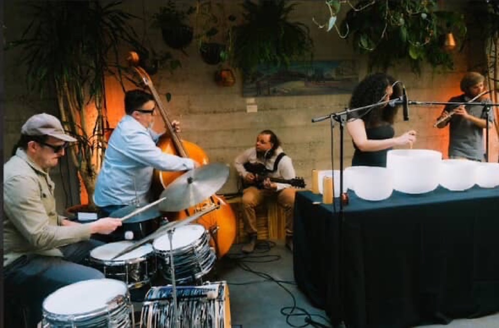 Simago performing with singing bowls